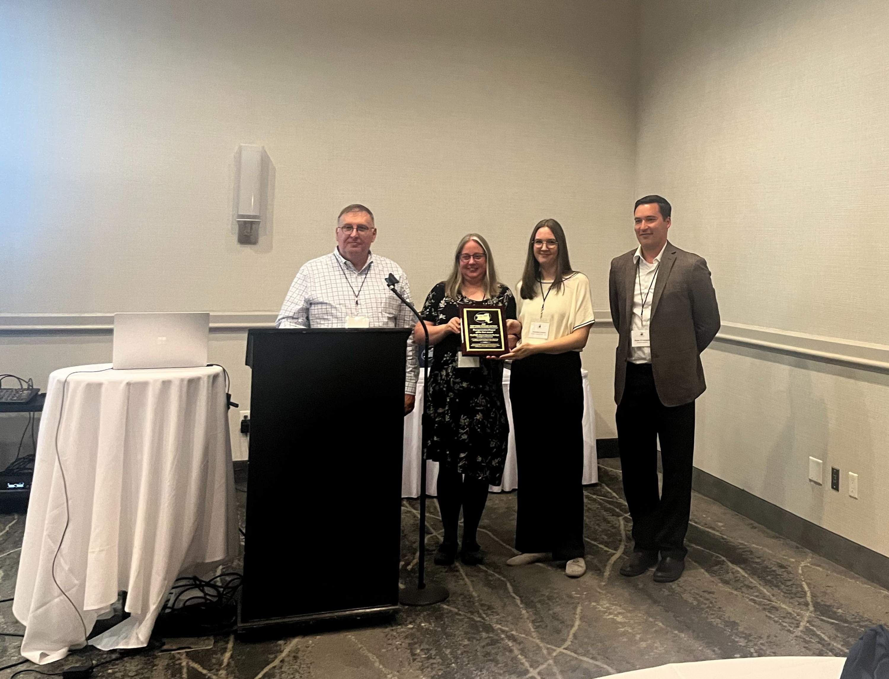 Jeanette Koch (left) and Tori Coners (right) receiving the award on behalf of Watts